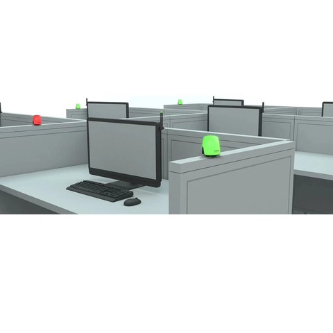 Kuando Busylight Omega in use on office cubicle desks showing green and red status lights